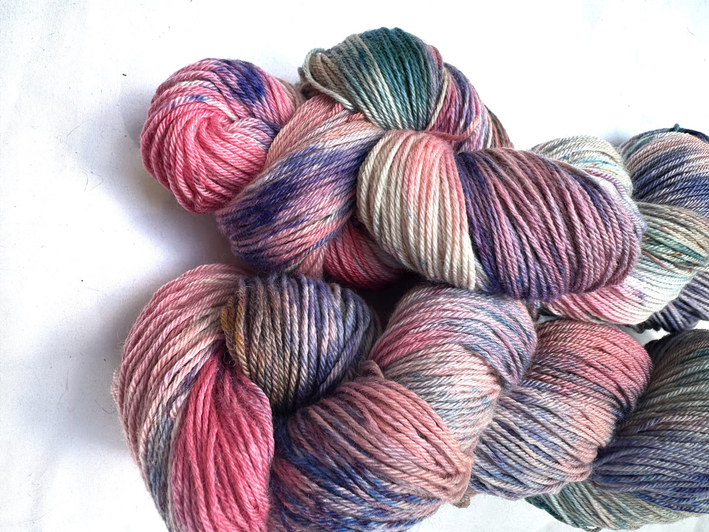 Variegated pink teal blue purple MCN fingering