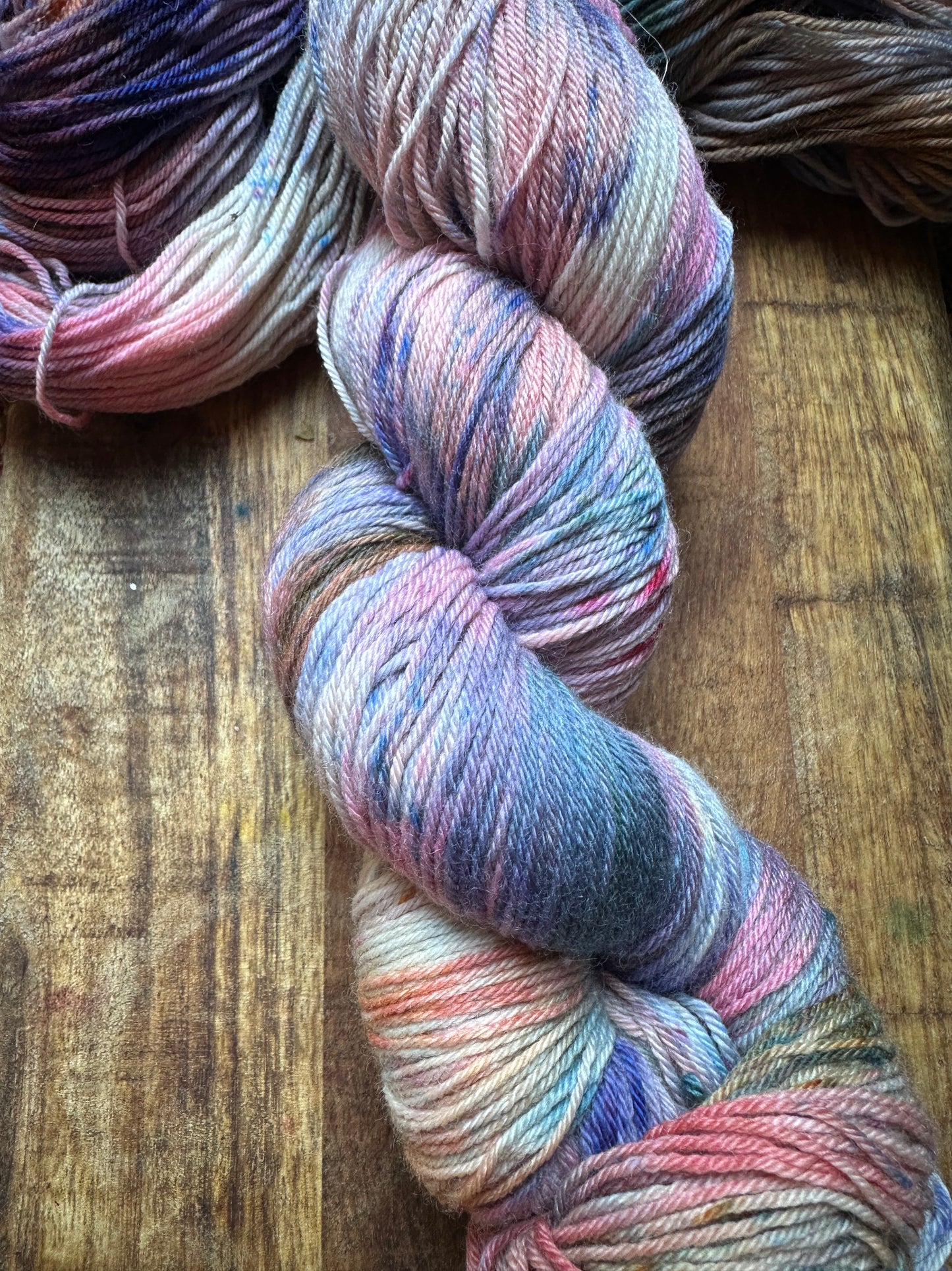 Variegated pink teal blue purple MCN fingering