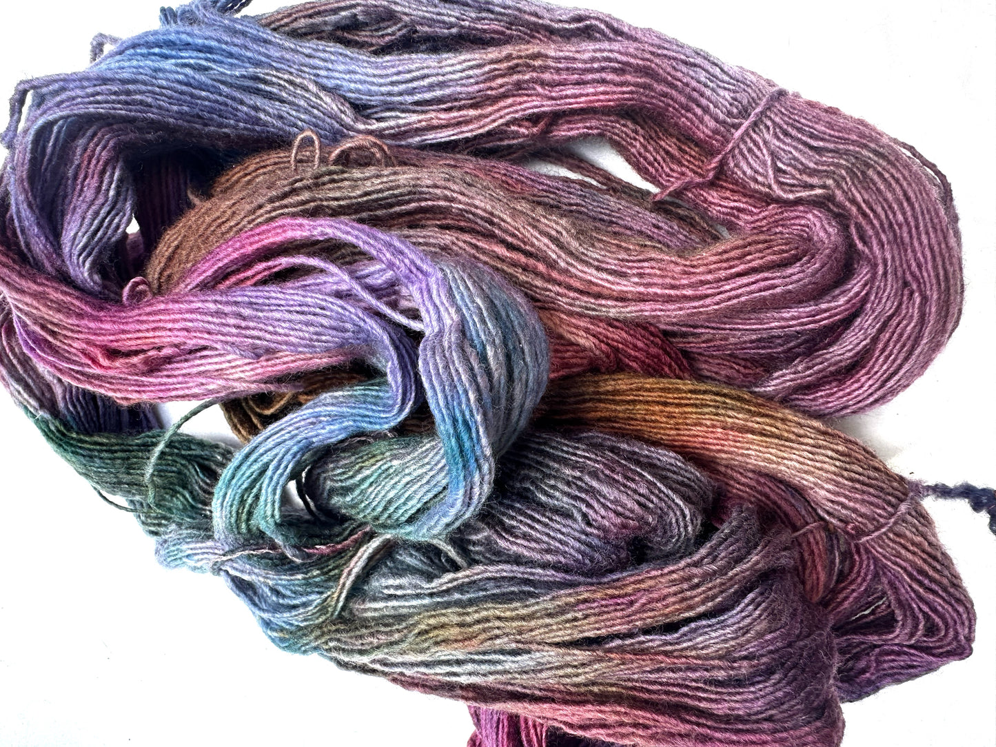 Variegated pink teal blue purple MCN fingering