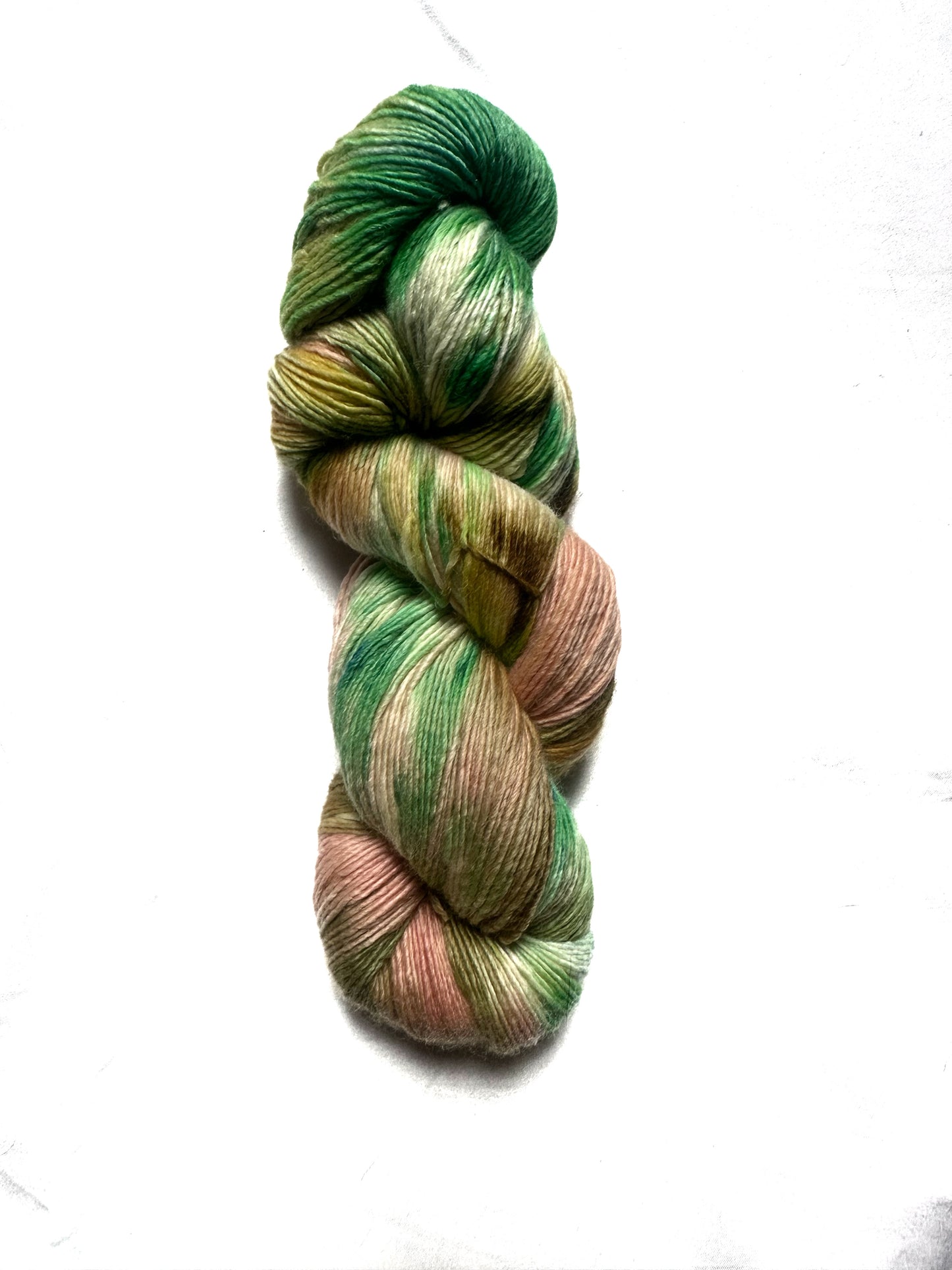 Fingering peach green variegated