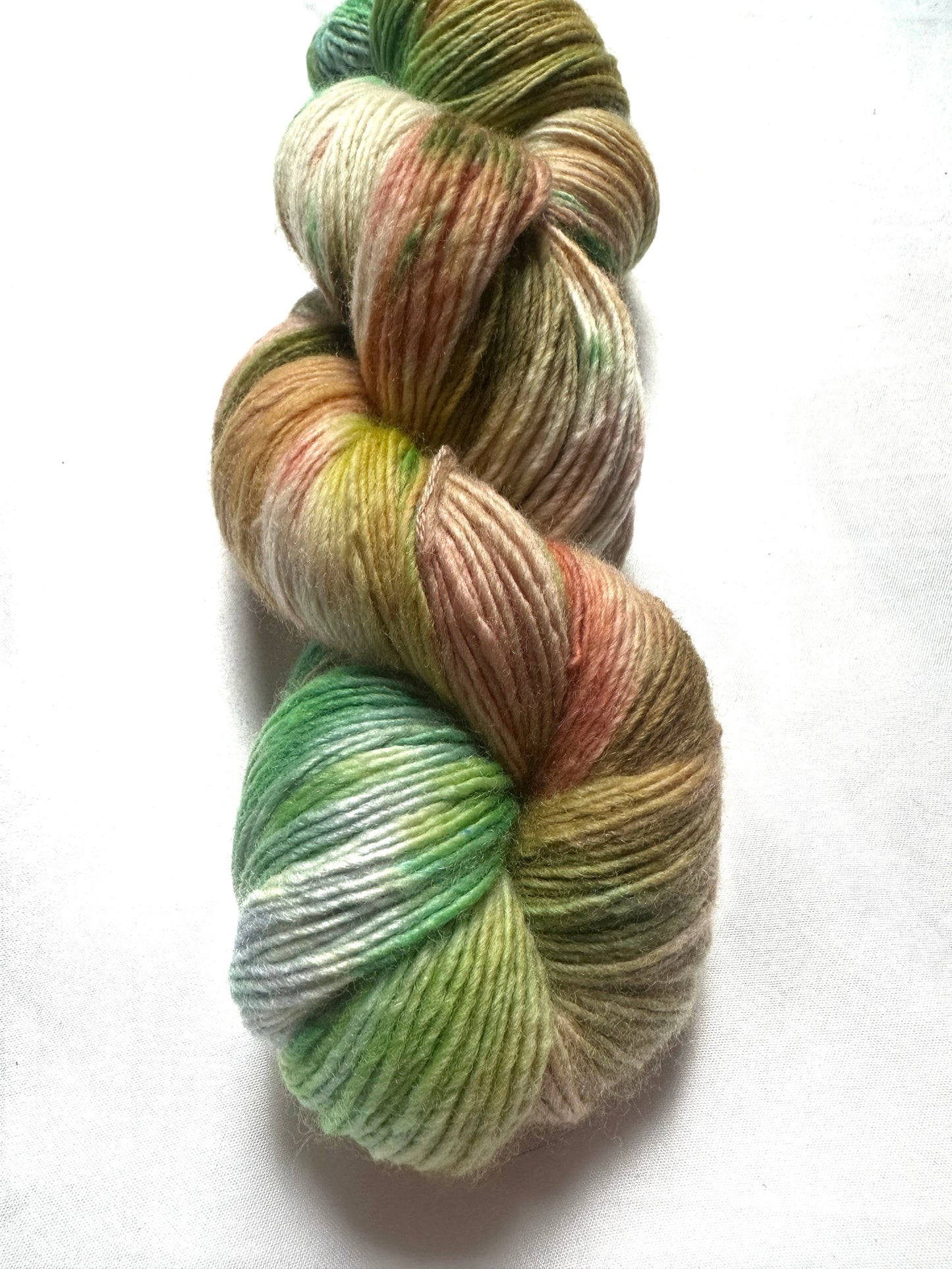 Fingering peach green variegated