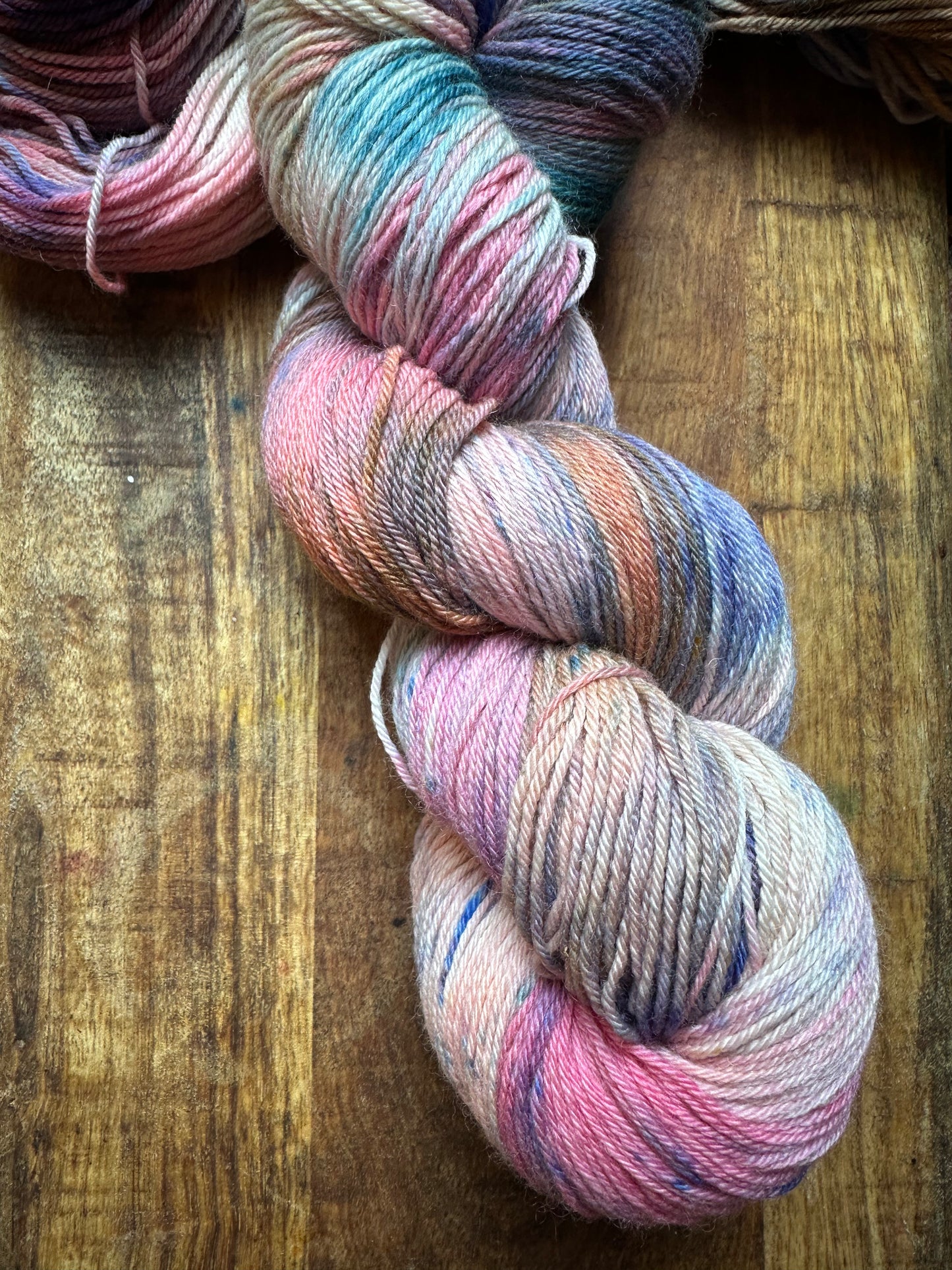 Variegated pink teal blue purple MCN fingering