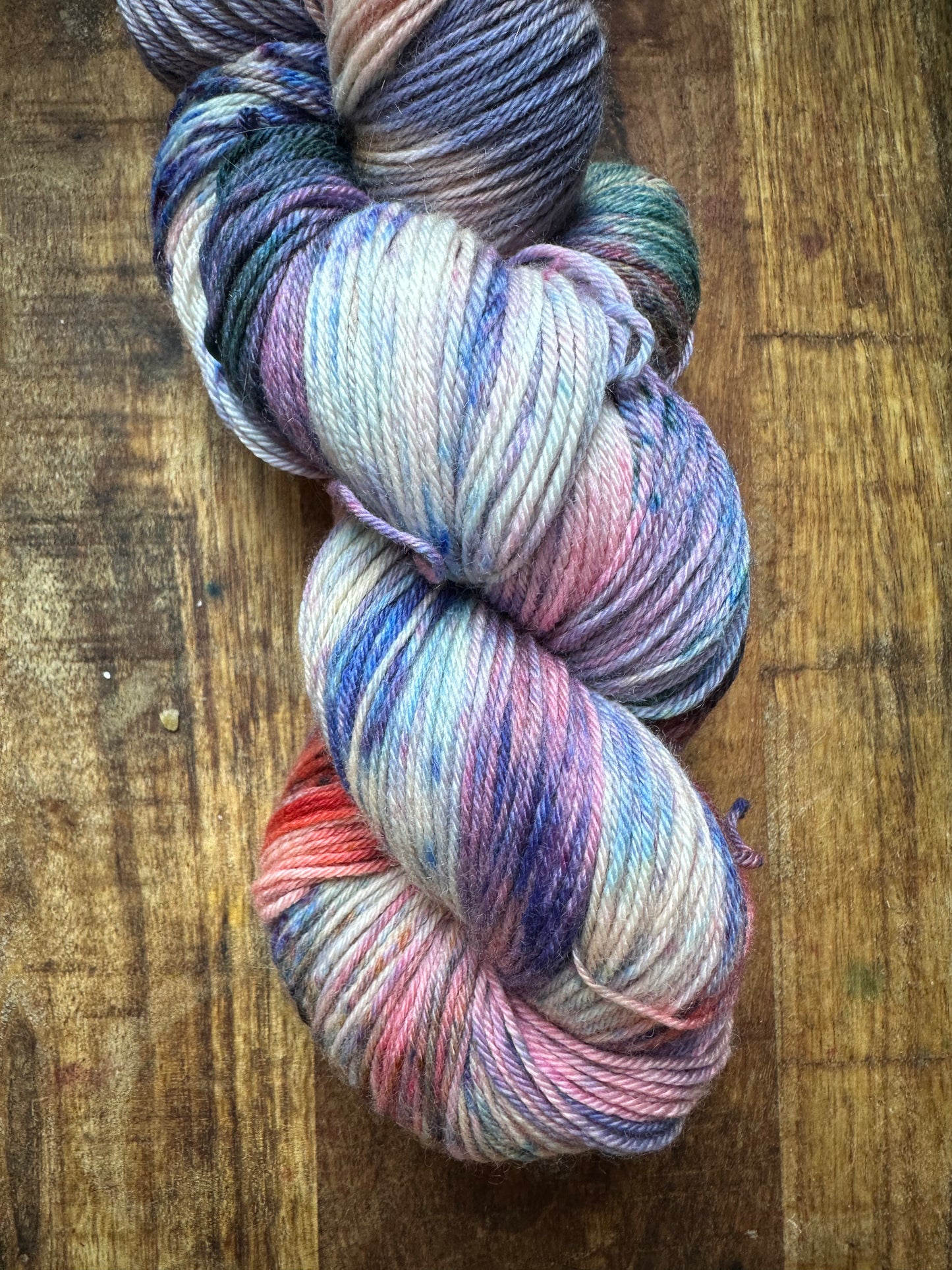 Variegated pink teal blue purple MCN fingering